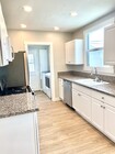 Kitchen with adjacent laundry room - 10134 Memory Park Ave House