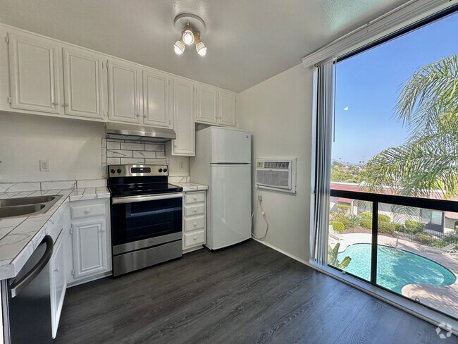 Building Photo - Upgraded 2 Bedroom Condo in San Carlos!! ... Unit 318