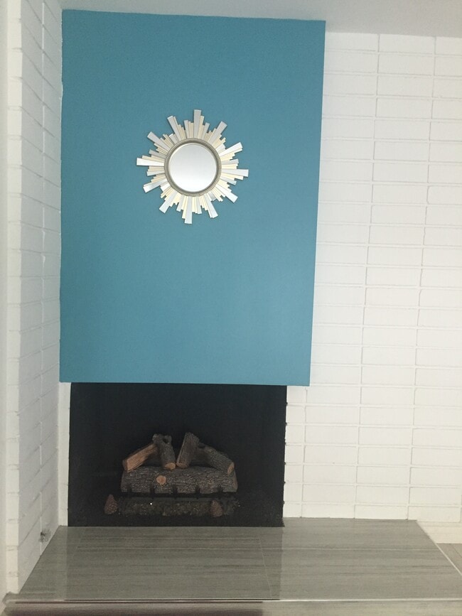 fireplace w/ new logs - 1214 Rutland Rd Apartment Unit 1