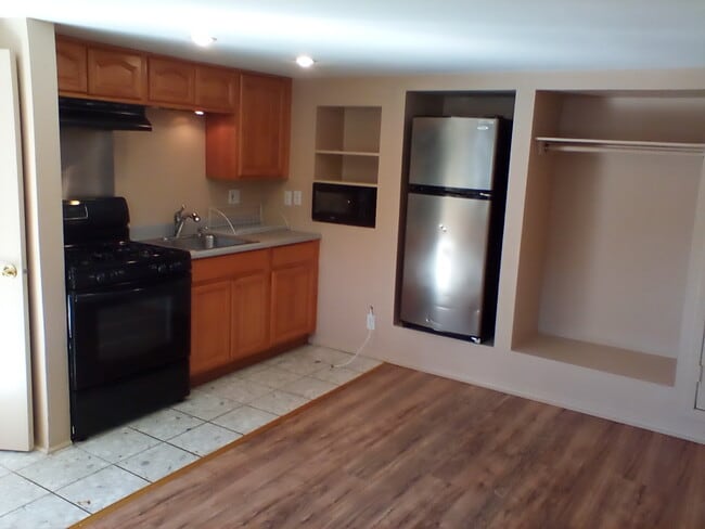 Kitchen area with appliances. - 6200 St Albans St Unit Studio