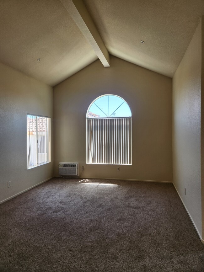 Living room with vaulted ceiling - 9502 Walker St Unit 4