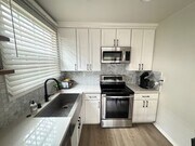 New kitchen cabinets and appliances - 630 E San Antonio Dr Apartments Unit #1
