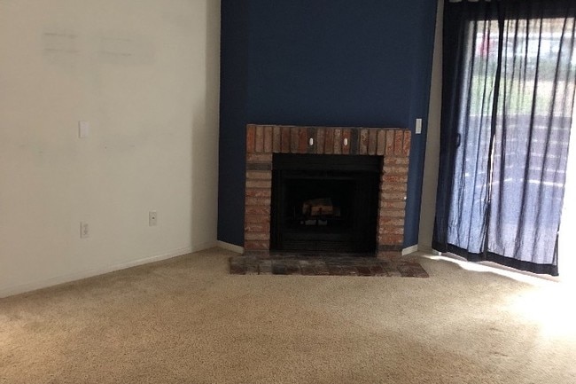 Fireplace in living room - 1730 S El Camino Real Unit 105
