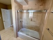 Tub/shower combination in master bathroom. - 1450 E Granvia Valmonte