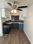 Updated kitchen with quartz countertops and stainless steel appliances - 1016 Western Ave Unit G