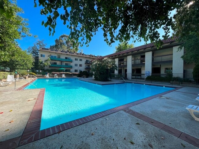 Photo - AVAILABLE NOW! 1BR w/patio, pool + spa, gym, parking + MORE!