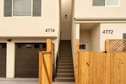 View of private garage off alley, and stairs leading to upstairs unit 4774 - 4774 Bancroft St Townhome