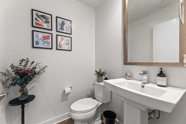 Primary floor half bathroom off of Kitchen. - 215 Elm Ave