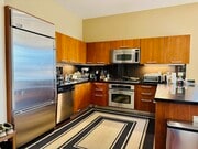 Kitchen w/ stainless steel appliances - 801 S Grand Ave Condo Unit 2201