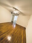 warm wood floors welcome you home - 5876 Bowcroft St Condo Unit 2