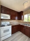 Kitchen stove and stainless steel sink - 1156 N Chicago St Unit 4