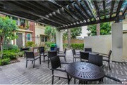 Barbecue space besides the pool - 8074 Ackerman St Townhome