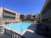 Swimming pool and sun deck at Villa Pacific Apartments in Oceanside, California. - Villa Pacific Apartments