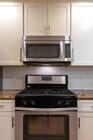 Kitchen Range & Microwave - 8746 Reading Ave Apartments Unit 8746