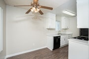 Interior dinning room to kitchen Unit 115 - The Pointe at 2316 Apartments