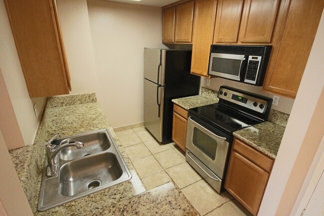 Building Photo - Upgraded UTC Condo in Quiet, Serene Setting