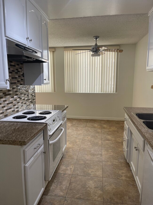 Kitchen with stove - 630 E Orange Grove Ave Unit #A