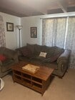 couch and soifa chair for relaxation - 7073 Mewall Dr House