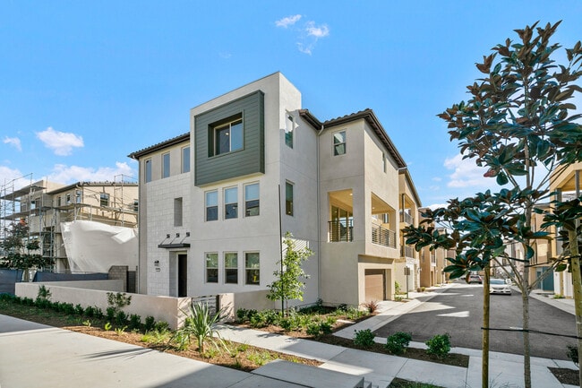 Side view from front with private deck above garage entrance - 590 Catalonia