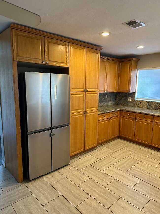 Kitchen with eat at bar - 1845 Reed Ave