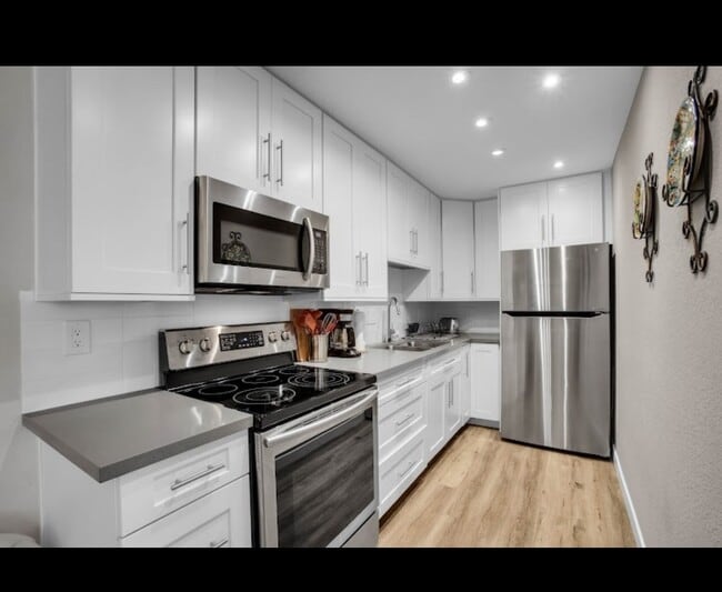 Kitchen with new appliances - 2810 N Arcadia Ct Condo Unit A113