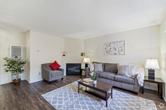 Spacious living room with a fireplace at the Enclave apartment in Studio City - The Enclave Rental