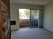 Living room with balcony. - 3717 Cardiff Ave