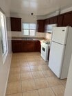 Newer gas stove, oven, microwave. Refrigerator. - 4626 E 7th St Unit upstairs 1bed 1bath