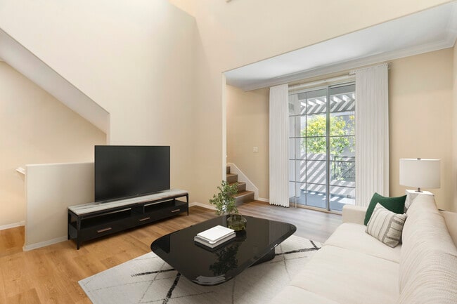 Renovated Package I living room with hard surface flooring - Avalon Glendale