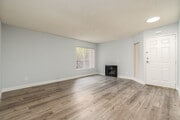 2BR, 2BA - 875SF - Living Room - Carlton Way Towers