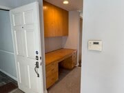 View from entry/living room into hallway with built in desk - 1649 Appian Way Unit 210