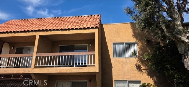 Building Photo - 6600 Warner Ave Unit 56