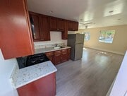 Kitchen open to living area with natural light - 6534 Peterson Ave