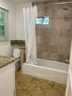 NEW TILED SHOWER - 10949 Massachusetts Ave Apartments