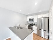 Photo - Spacious 2B/1.5BA Condo in Bay Park! Reserved Parking, Balcony, Fireplace Display & Pool! Unit 2