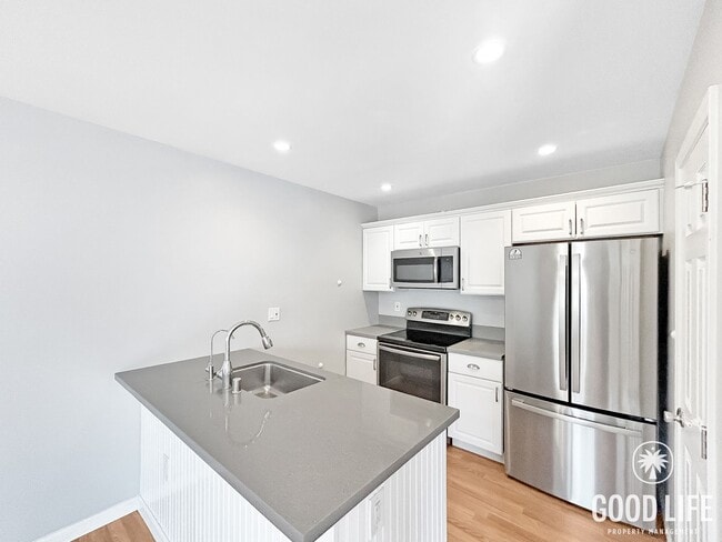 Photo - Spacious 2B/1.5BA Condo in Bay Park! Reserved Parking, Balcony, Fireplace Display & Pool! Unit 2