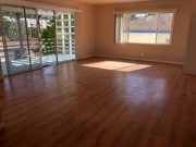LIVING ROOM AND BALCONY - 2119 1/2 S Beverly Glen Blvd Apartments