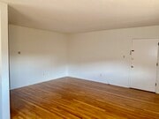 Living room with an A/C unit - 4039 Duquesne Ave Apartments Unit 4039