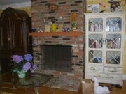 Beautiful floor to ceiling woodburning, brick fireplace - 1857 Pandora Ave Apartments Unit 1857
