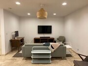Tastefully Furnished Living Room - 65 “ Samsung - 5651 Sumner Way Condo Unit 209