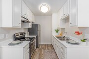 2BR, 1BA - 900SF - Kitchen - Courtyards Apartments