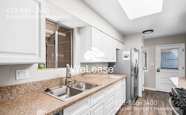Building Photo - 4577 Olive Ave Unit 1