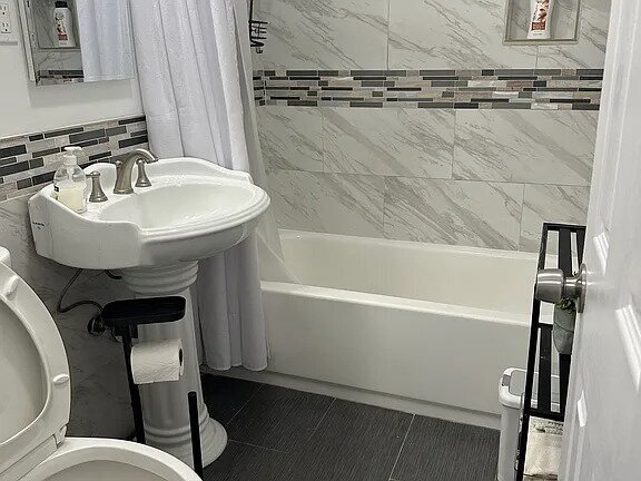 Building Photo - This beautifully remodeled 3-bedroom, 2-bathroom home is designed with an open concept layout