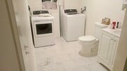 Bathroom with washer and dryer - 690 W 8th St