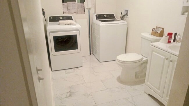 Bathroom with washer and dryer - 690 W 8th St