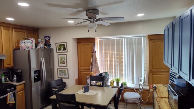 Stainless steel side by side fridge lots of cupboard space large kitchen with dining table - 1365 Crafton Ave Unit 2006