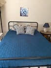 Queen-size bed has new mattress topper. - 20050 Dorothy St