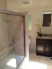 Bathroom, travertine shower - 3463 Mandeville Canyon Rd Townhome