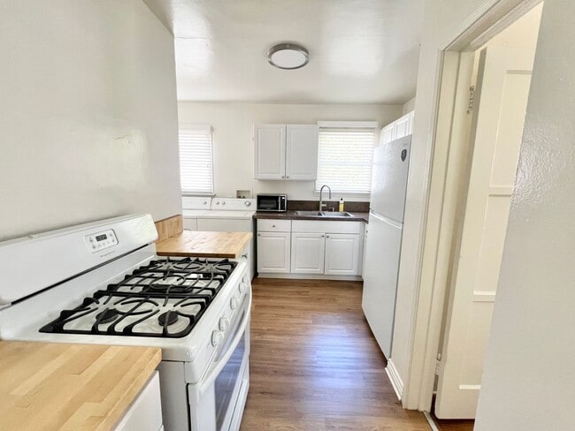 Photo - Charming 2-Bedroom Home with Hardwood Floors & Fireplace Near the Traffic Circle Unit 4510 E 15th St