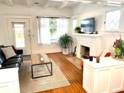 Spacious layout with hardwood floors and ceiling beams that connects directly to the front porch. - 6000 Carlton Way